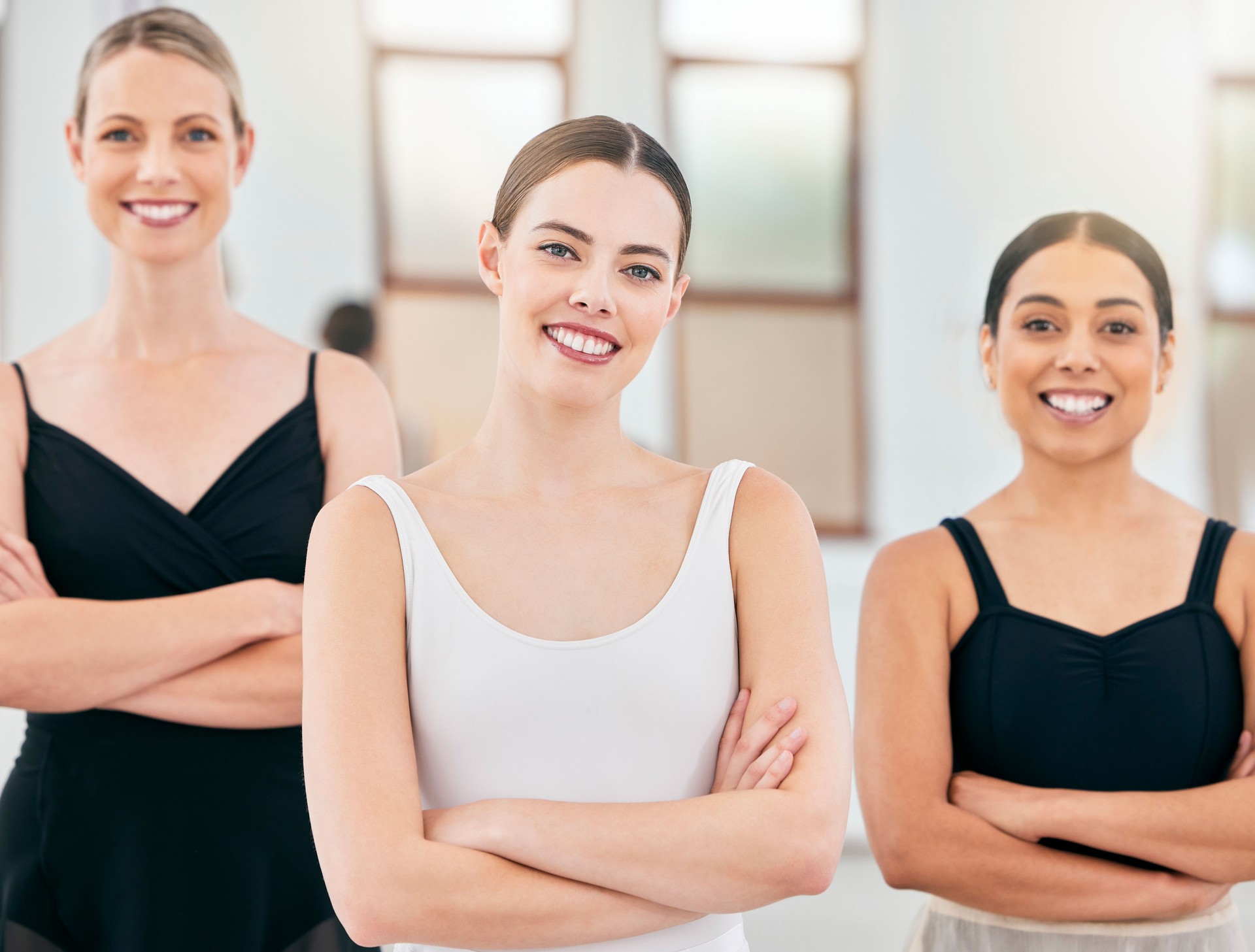 Portrait, happy and ballet teacher with students in a classical arts school after training, practice and class. Smile, women and fit talent coach proud of girls dance commitment, dancers and dancing